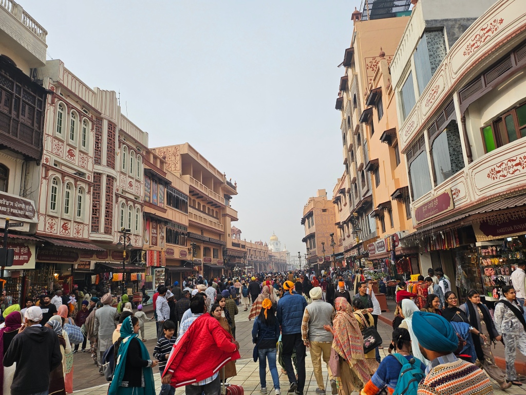 A first view of the Golden Temple of Amritsar as you walk through the streets.